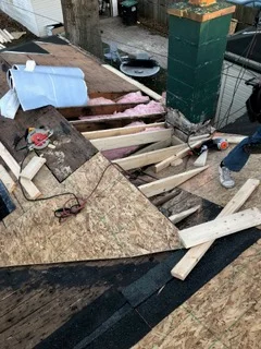 Roof decking replacement with exposed framing and new plywood installation