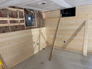Interior framing with wood studs, blocking, and drywall backing installation