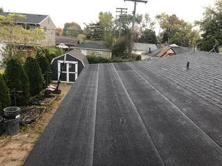 New asphalt shingle roof installation on residential home with multiple roof planes